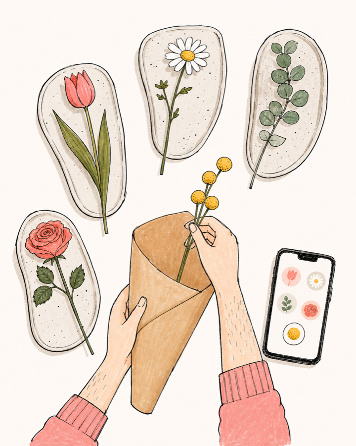 Des mains sélectionnent des fleurs une par une pour composer un bouquet